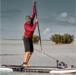 Man standing on paddleboard using the Blackfin sand spear | Lifestyle