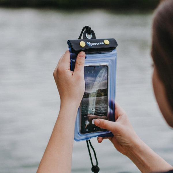 Person capturing a photo with the waterproof cell phone case